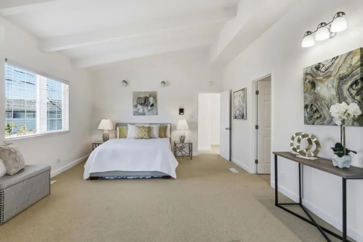Expansive primary suite featuring fireplace, sitting area, and access to a private retreat.