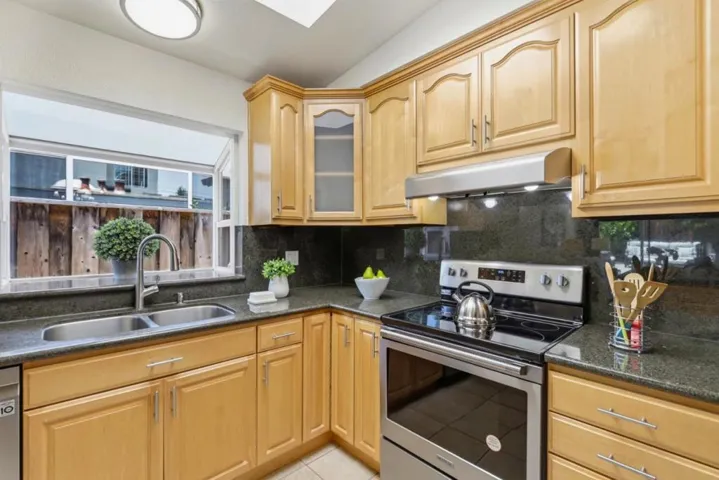 Well-designed kitchen with abundant cabinetry and granite countertops.