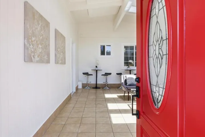 Bright entry foyer with soaring ceilings and abundant natural light.