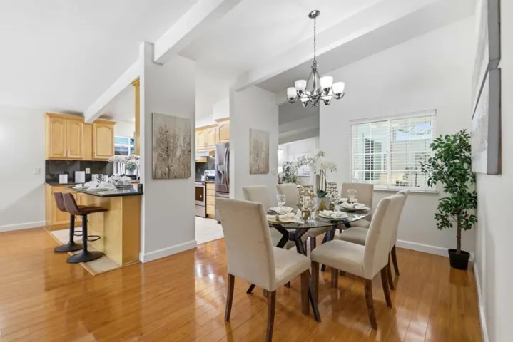 Elegant formal dining room with soaring ceilings and an open layout perfect for entertaining.
