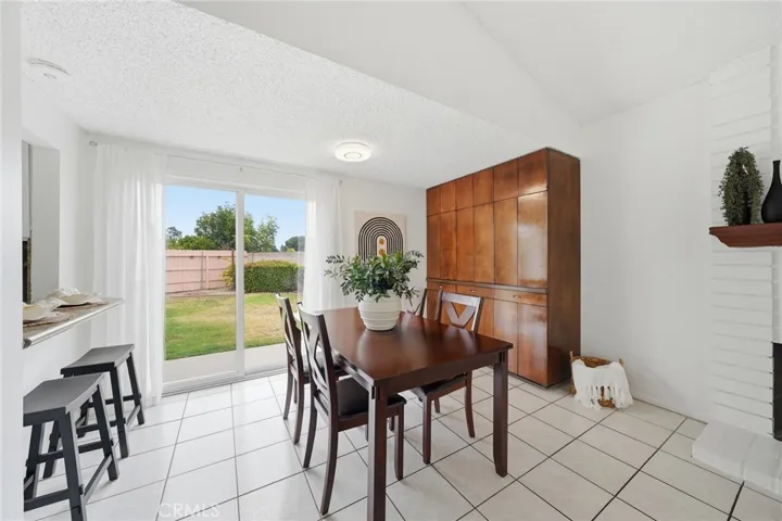 Dining Room, Staged, and Built -In- Wood Cabinet with Wet Bar.