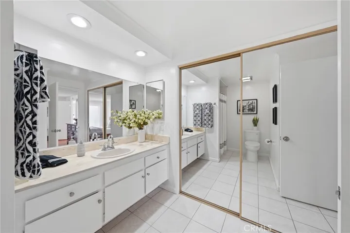 Primary bathroom with extra closet.