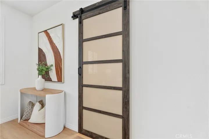 Privacy barn door to the primary bathroom