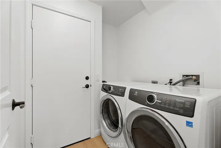 Door to garage with laundry