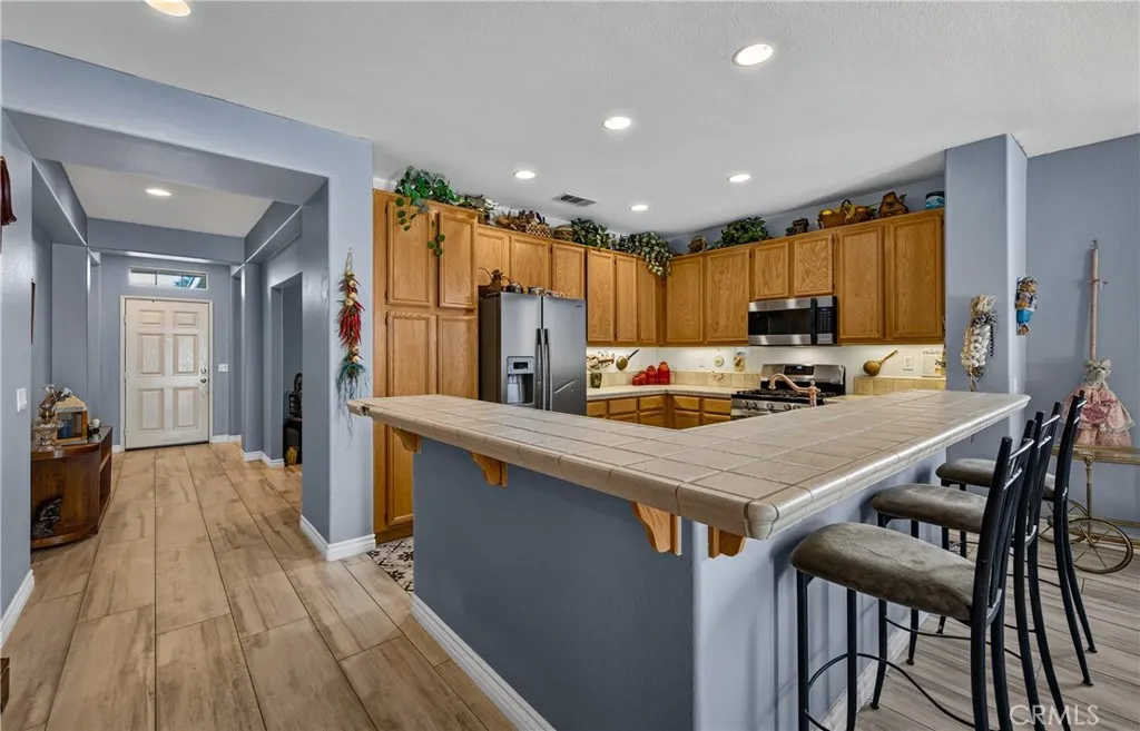 Kitchen open with wraparound Breakfast Bar.
