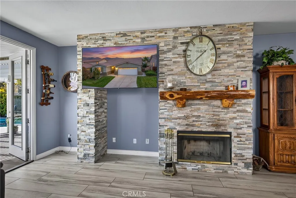 Custom stacked stone and wood burning fireplace.