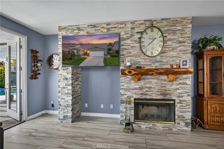 Custom stacked stone and wood burning fireplace.