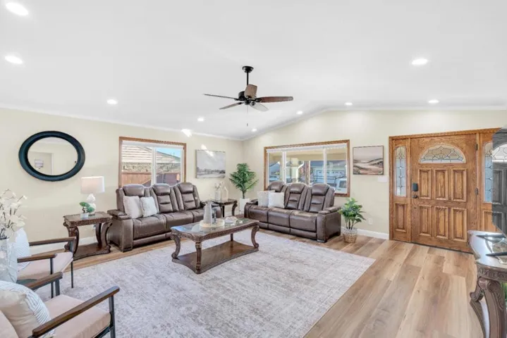 Open living room. New floors.  Vaulted ceiling. Beautiful wood entry door.
