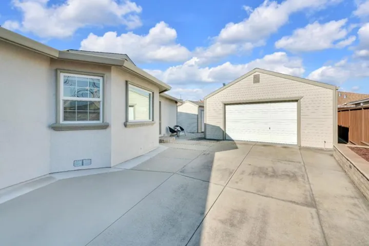 Side view showcasing detached & RV parking.