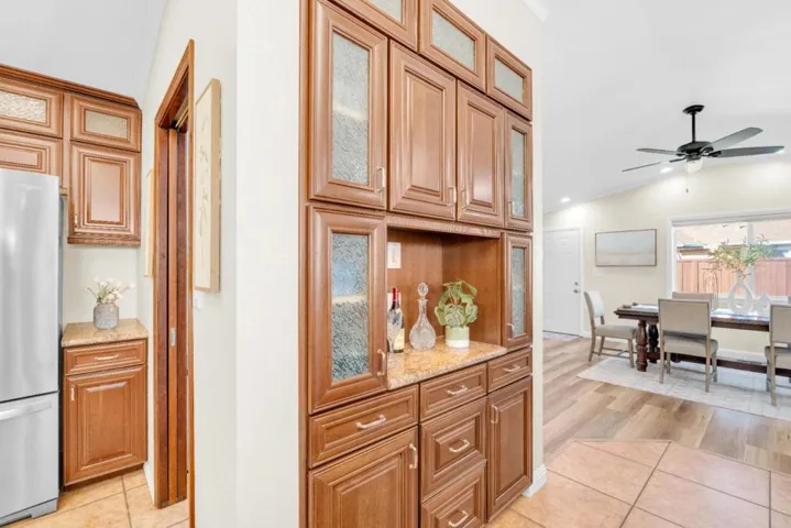 Built-in china cabinet hutch/coffee bar between the kitchen and dining