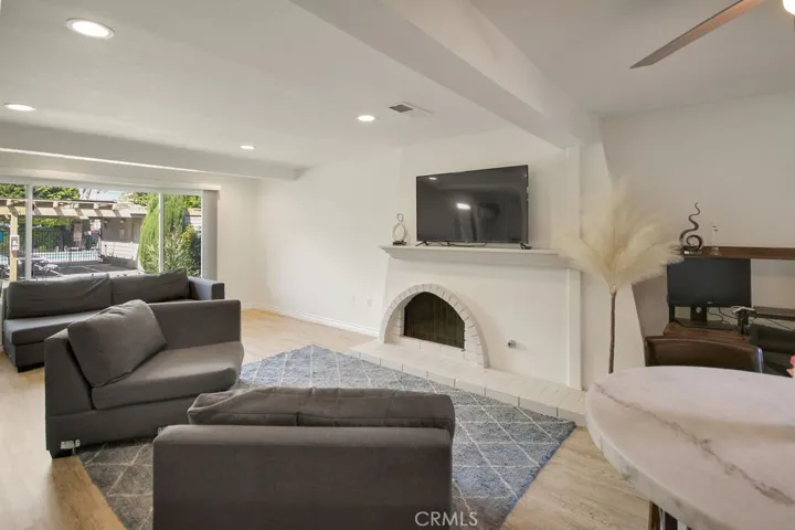 Large bright window, open beam ceiling, recessed lighting, vinyl flooring add charm and charachter.