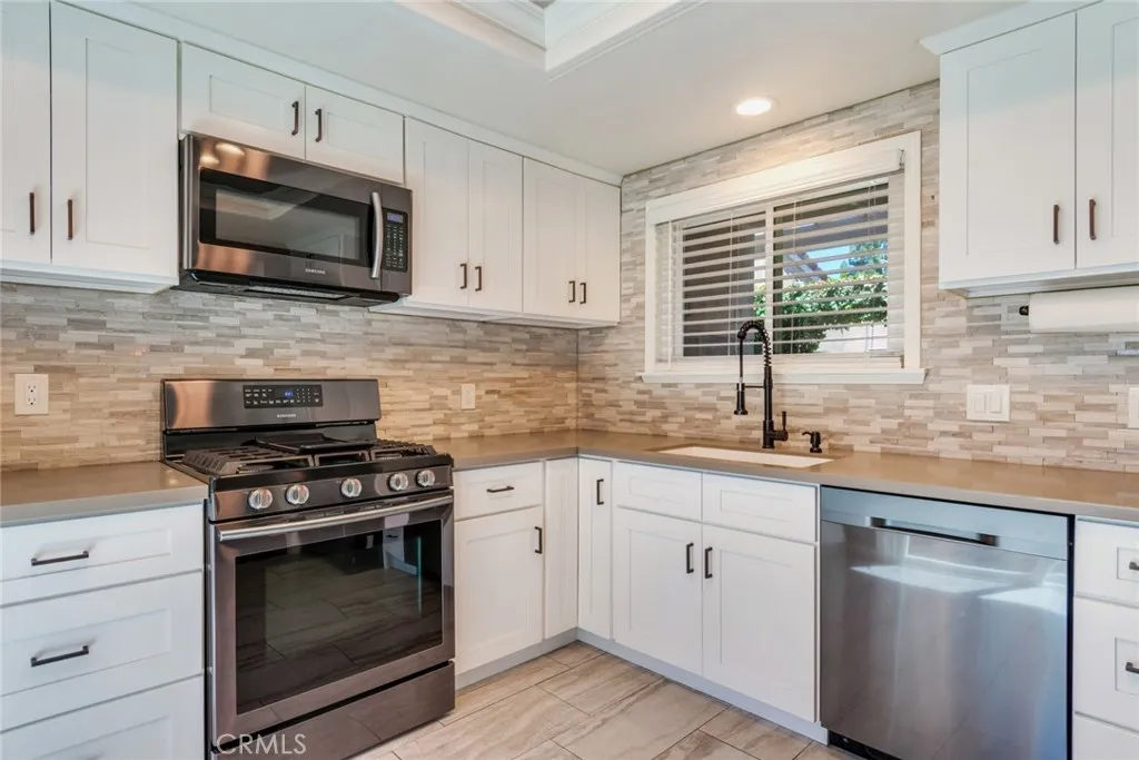 Wonderfully updated kitchen with stainless appliances. Refrigerator included in sale