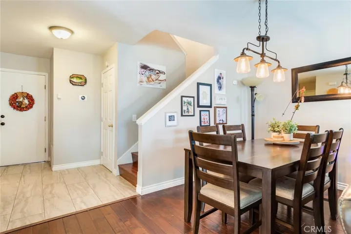 Large dining area with newer flooring though out along with lighting fixtures and paint