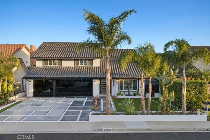 Additional highlights include a charming front-yard water fountain, storage shed, and ample space for outdoor entertainment