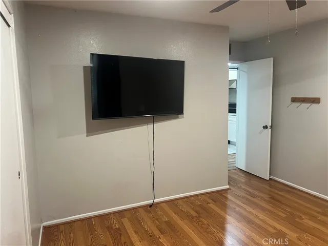 2nd bedroom w/ wall mounted TV