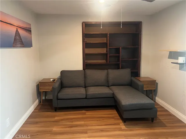 Living room area w/ built in bookcase