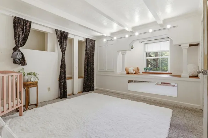 A highlight of this room is a cozy nook with window