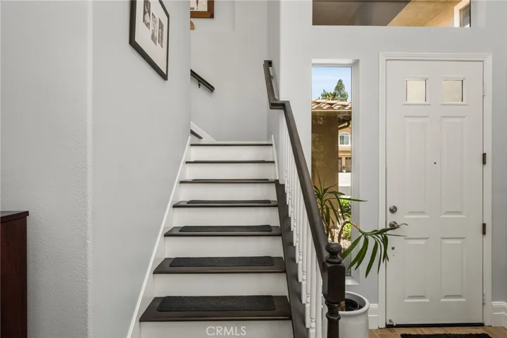 Gorgeous custom stained staircase with white risers