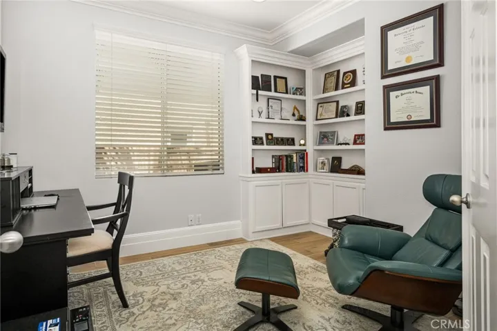 Main floor den/office (could add closet back where book cases are to convert to main floor 5th bedroom)