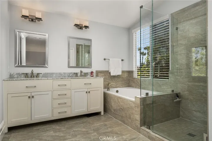 Upgraded primary bath with custom vanity with marble top