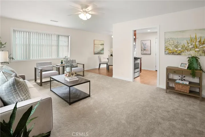 Living Room opens into the Kitchen and Dining Area
