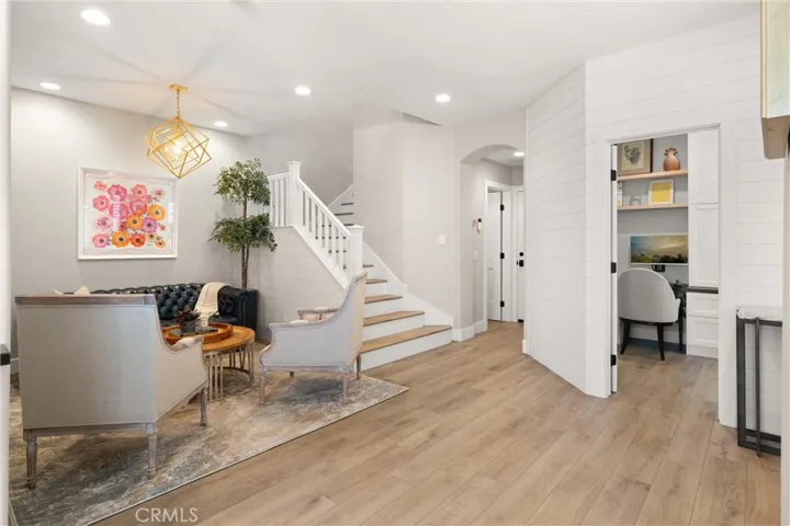 Welcoming living room with designer lighting and an open, light-filled layout