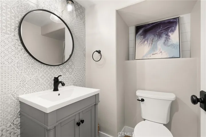 Main-level powder room with stylish finishes throughout