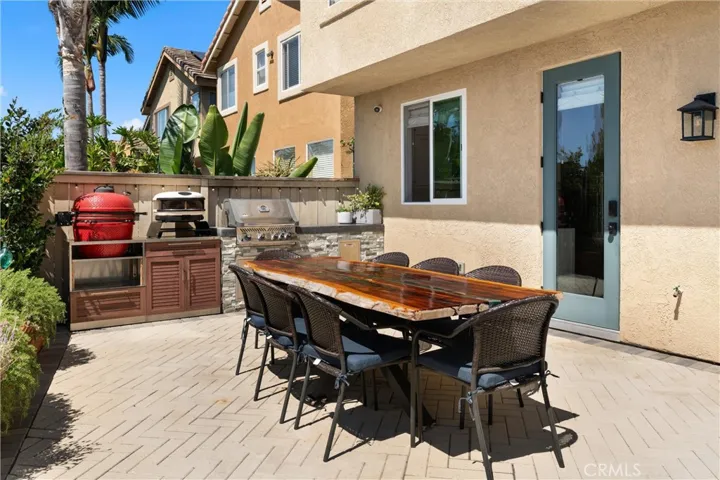 Outdoor cooking station featuring a built-in BBQ, smoker, and ample prep space