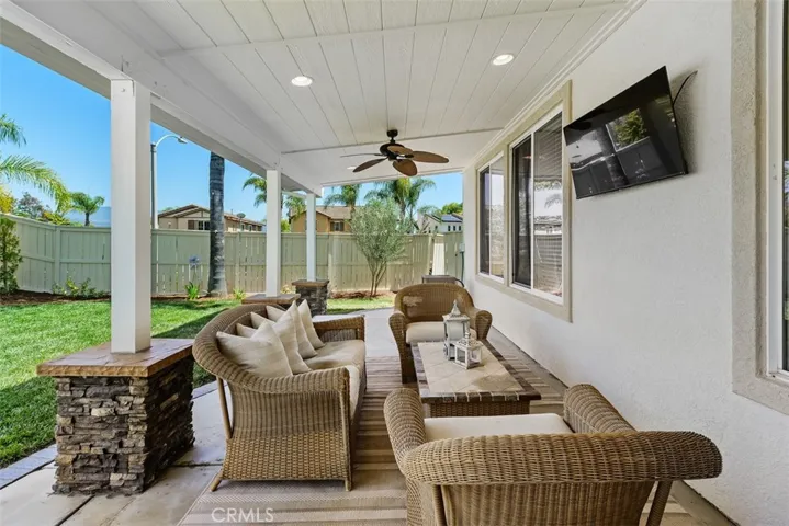 Covered patio with recessed lighting and ceiling fans