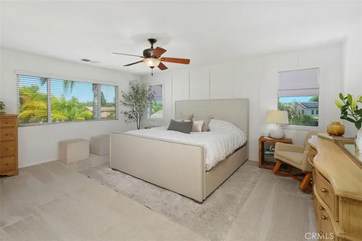Bright and open Primary Suite. New board and batten accent wall,  mountain views