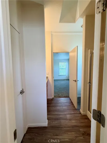 Looking from laundry into bathroom and primary