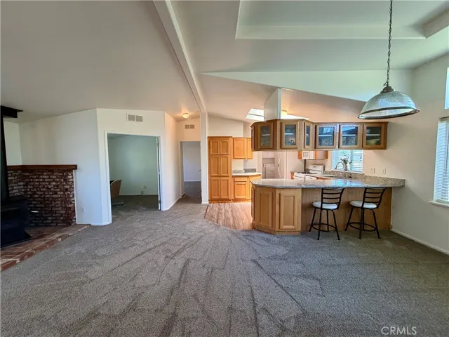 Shows vaulted ceilings and natural light