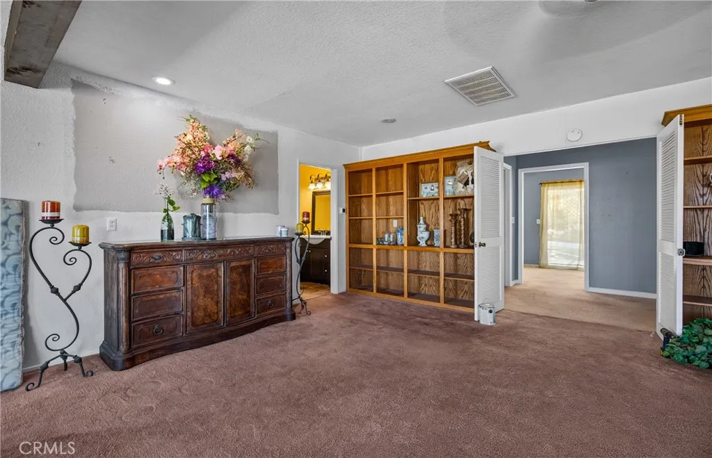 Front Living Room. Powder Room is adjacent to this room.