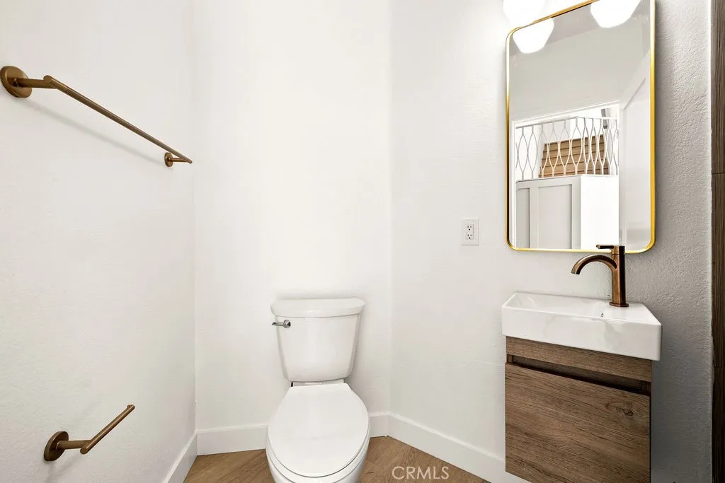 Stylish downstairs bathroom with designer vanity and updated fixtures.