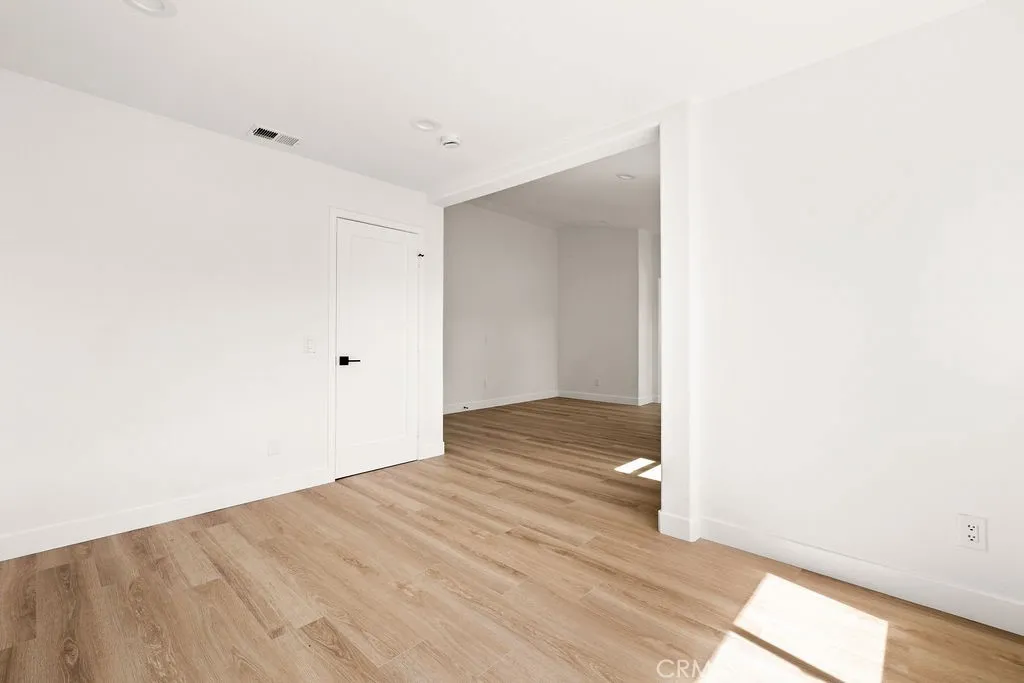 Oversized primary suite provides room for a sitting area, workspace, or reading nook.