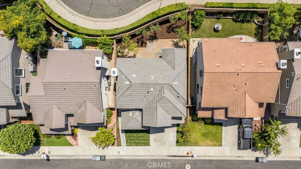 Overhead aerial view showcasing the home's lot placement and backyard layout.