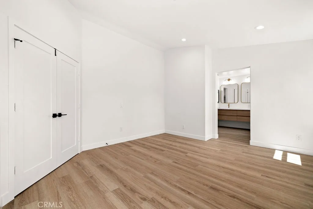 Oversized primary suite with double door entry.