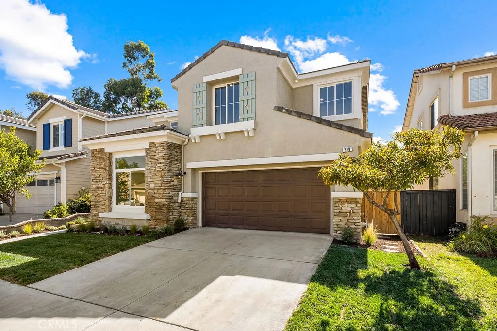 Front exterior highlighting the home's welcoming curb appeal and spacious driveway.