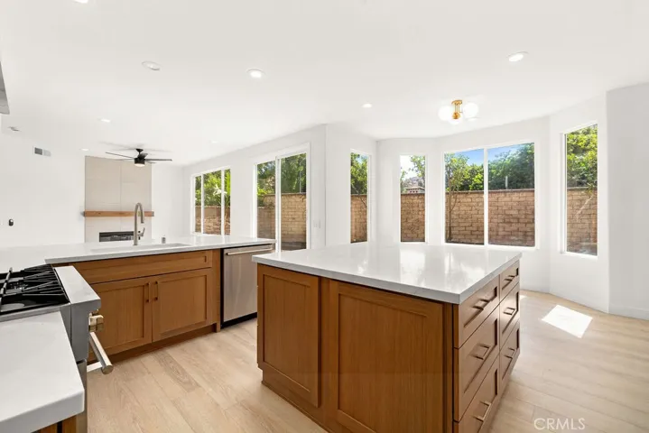 Spacious kitchen with expansive quartz countertops overlooking the family room and dining area.