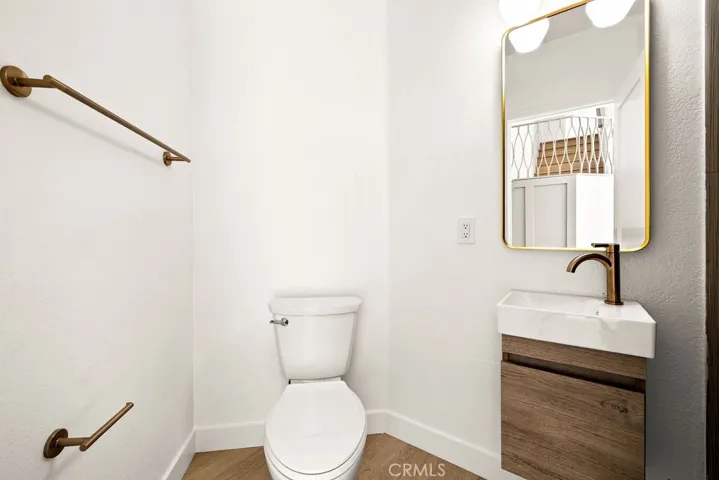 Stylish downstairs bathroom with designer vanity and updated fixtures.