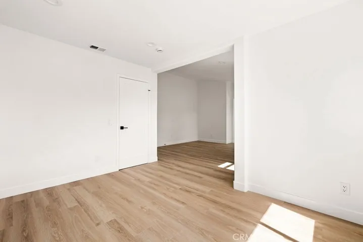 Oversized primary suite provides room for a sitting area, workspace, or reading nook.