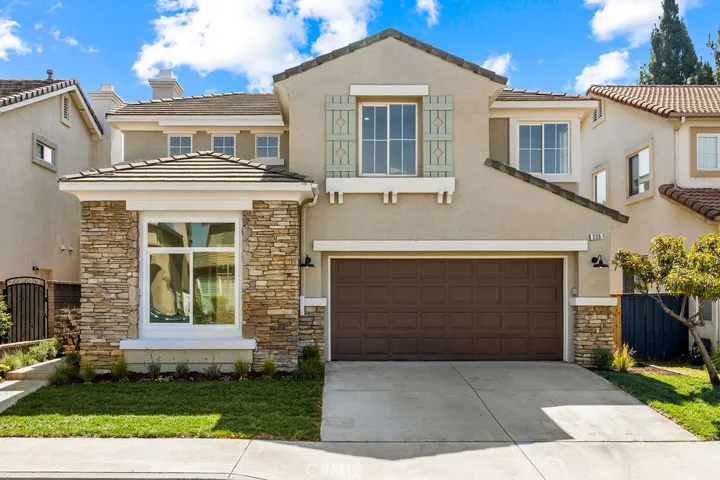 Beautifully updated front elevation with stone accents and an inviting curb appeal in the desirable Santiago Hills community.