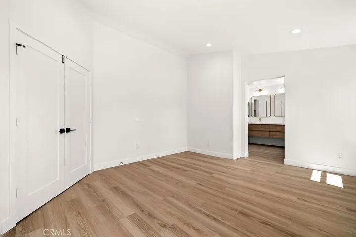 Oversized primary suite with double door entry.