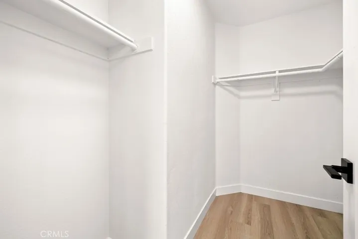 Walk-in closet providing generous storage and organization.