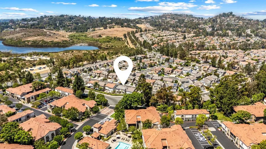 Aerial perspective showing the home's proximity to surrounding parks, open space, and scenic hills.