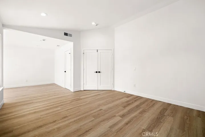 Oversized primary suite provides room for a sitting area, workspace, or reading nook.