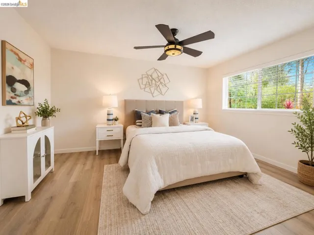 Bright room with wood-finish flooring and a wide window