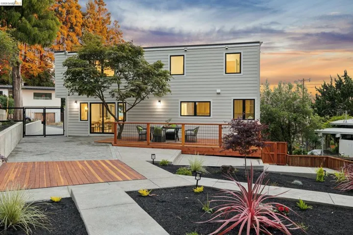 Contemporary two-story exterior with horizontal siding and black-framed windows