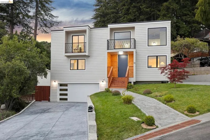 Modern architectural facade featuring light-toned horizontal siding