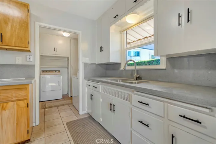 Kitchen with view of laundry room